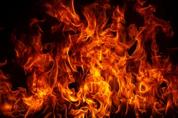 Gordijnen Blaze brandende vuurvlam op de achtergrond van de kunsttextuur. © Volodymyr