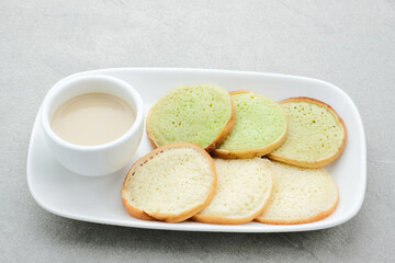 Serabi or Surabi,  Indonesian pancake made of flour, rice flour and coconut milk. Served with palm sugar sauce. Sweet and savory. 
