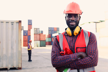 Portrait of happy smiling African American young engineer worker man wearing safety bright neon red...
