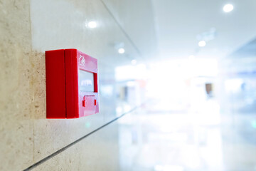 Red fire alarm on the wall