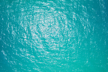 Fototapeta na wymiar Nature background of Sea surface aerial view. Bird eye view photo of turquoise waves and water surface texture green sea background. Beautiful nature Amazing view sea background