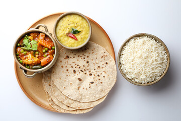 vegetarian Indian thali or Indian home food with lentil dal, cauliflower curry, roti or Indian flat bread and rice
