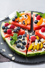 Watermelon pizza with berries, fruit, yogurt, feta cheese