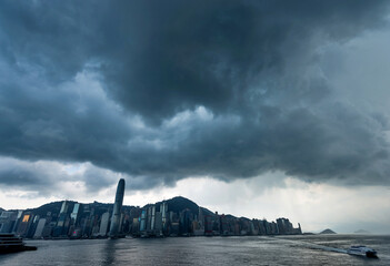 Hong Kong downtown with dark clouds in storm - obrazy, fototapety, plakaty