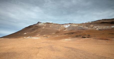 Fototapeta na wymiar Steaming fumarole in geothermal area of Hverir, Iceland