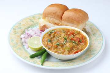 Mumbai Style Pav bhaji is a fast food dish from India, consists of a thick vegetable curry served with a soft bread roll