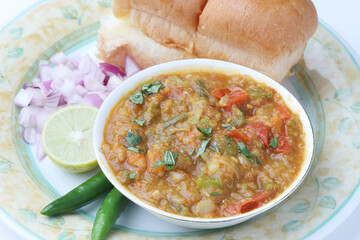Mumbai Style Pav bhaji is a fast food dish from India, consists of a thick vegetable curry served with a soft bread roll