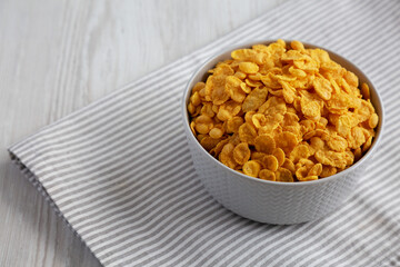 Tasty Corn Flakes in a Bowl, side view. Copy space.
