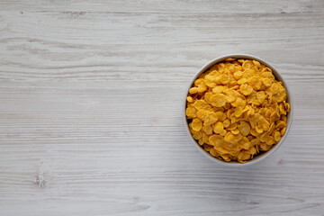 Tasty Corn Flakes in a Bowl, top view. Flat lay, overhead, from above. Copy space.