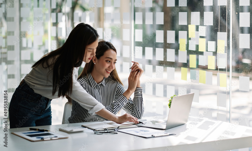 Poster businessman and business woman discuss to working with using laptop computer and for searching infor
