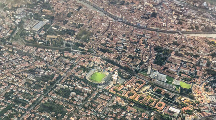 Aerial view of Pisa landmarks and homes from the airplane, Tuscany