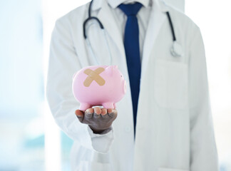 Need some debt counselling Visit our money clinic. Shot of an unrecognisable doctor holding a...