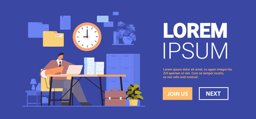 overworked businessman using laptop at workplace busy business man working in office paperwork deadline concept