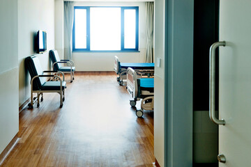 Empty bed in hospital ward