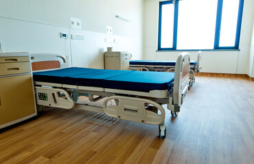 Empty bed in hospital ward