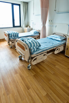 Empty bed in hospital ward
