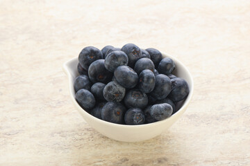 Sweet ripe blueberry heap in the bowl