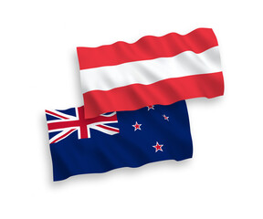 National vector fabric wave flags of Austria and New Zealand isolated on white background. 1 to 2 proportion.