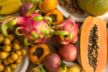 Tropical fruits set background. Dragon fruit. Papaya.
