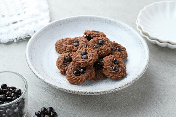 Chocolate chips cookies, served on chopping board, close up. Popular to celebrate Eid al Fitr. Selective focus.
