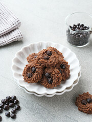 Chocolate chips cookies, served on chopping board, close up. Popular to celebrate Eid al Fitr. Selective focus.
