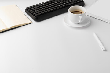 Obraz na płótnie Canvas Office desk with laptop, blank notebook and coffee cup