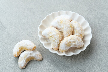 Kue Putri Salju or Snow White Cookies with crescent shaped. Made from flour, sugar and butter...