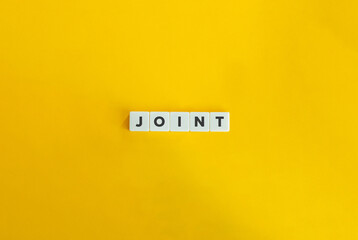 Joint in Banking. Letter Tiles on Yellow Background. Minimal Aesthetics.