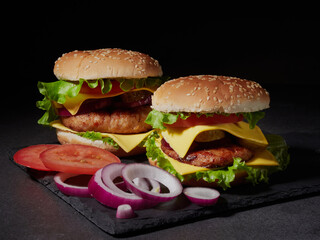 Fresh delicious burger on a dark background