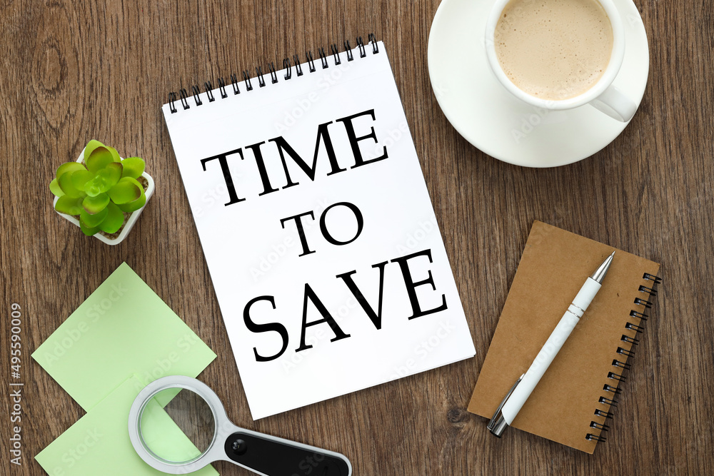 Aufkleber time to save. notepad on a wooden background with text