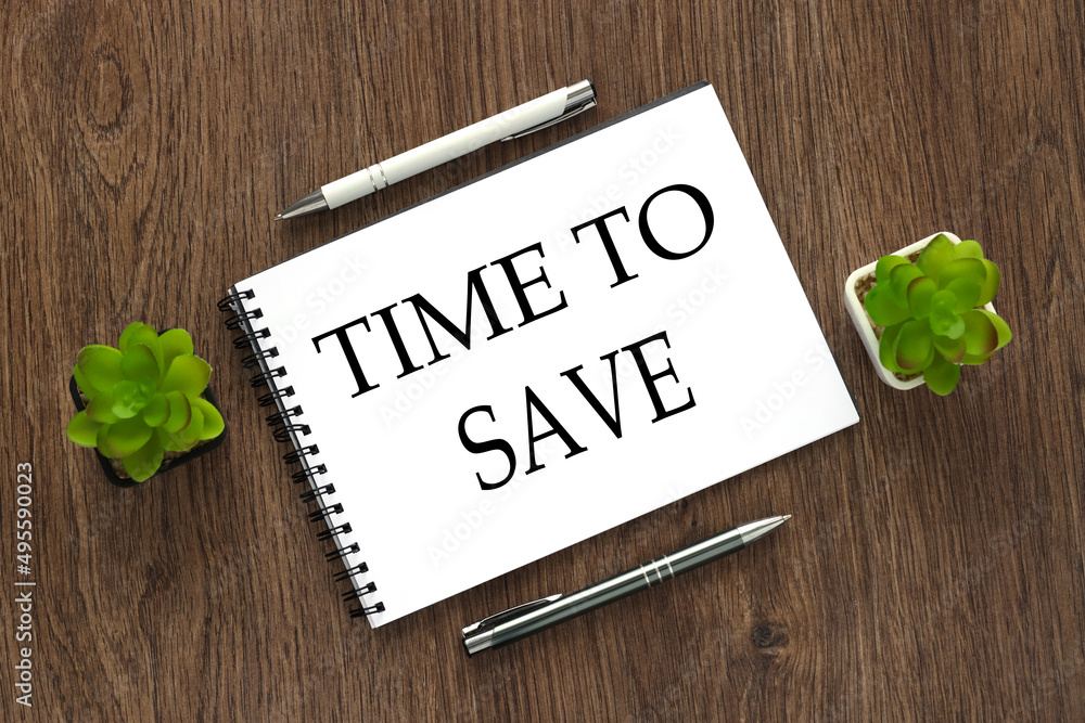 Aufkleber save the save. notepad on a wooden background with text