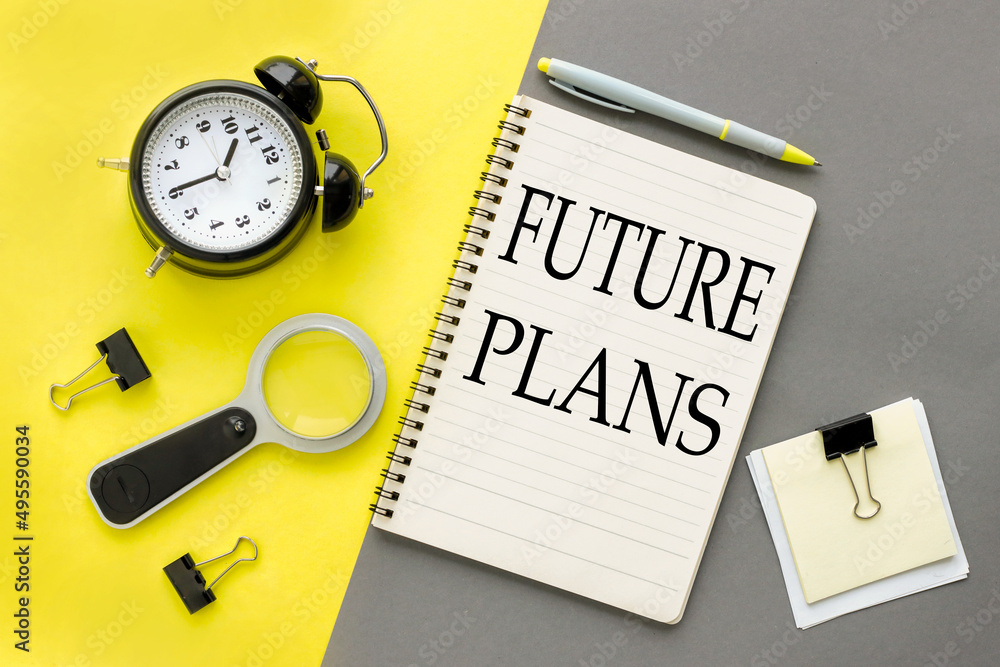 Poster future plans. notepad on a gray and yellow background. text on notepad.