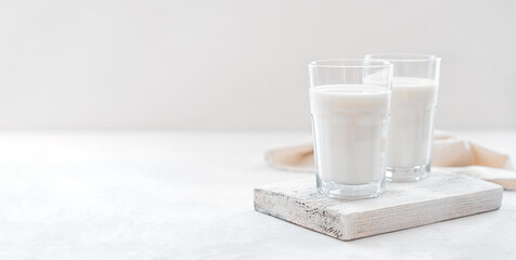 Milk on a light background with space to copy.