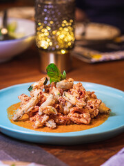 Deep fried Calamari with spicy tomato sauce, Italian food.