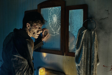 Zombie monster man front of broken mirror