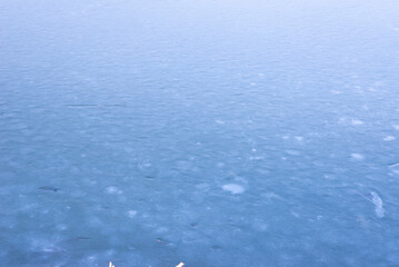 Natural texture of ice, frozen lake  as  background.