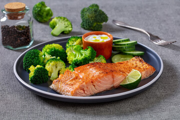 roast salmon fillet with boiled broccoli and sauce