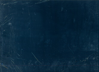 Scratched filmstrip. Aged texture. Flecks glow on dark background.