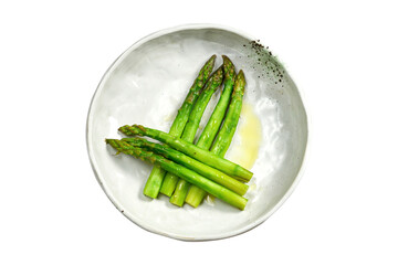 Fresh boiled asparagus with olive oil in a bowl on a white background