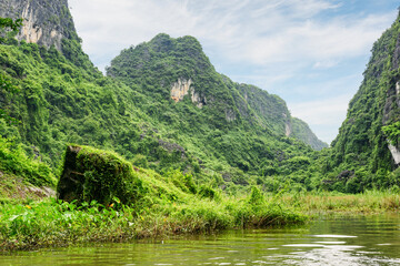 Fototapeta na wymiar Natural karst towers and the Ngo Dong River, Vietnam