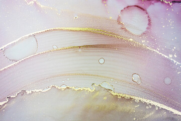 Luxury abstract painting in fluid art technique.Transparent layers of pastel pink and gold paints create marbled texture of stripes, swirls and veins with glowing gold and glitter. Natural beauty - 495596228