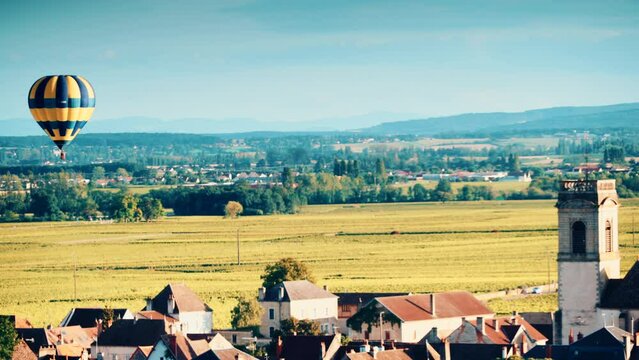 Pommard, Burgundy, France - August 8, 2021: Hot air balloon ride above the Burgundy landscape. Cote de Beaune, Pommard region.