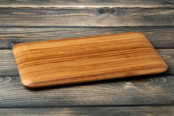 Wooden board for food on wooden background