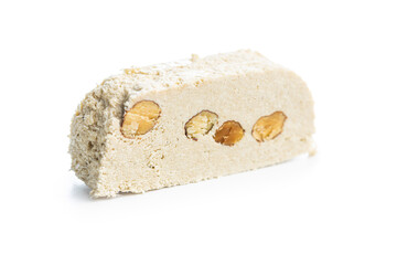 Sweet tahini halva with almonds. Turkish dessert isolated on white background.