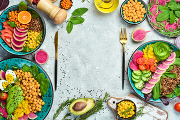 Set buddha bowl. Quinoa, chickpeas, avocado, fresh vegetables and nutritious food, Halthy eating, dieting food concept on a stone background.