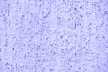 Concrete purple wall background on the street.