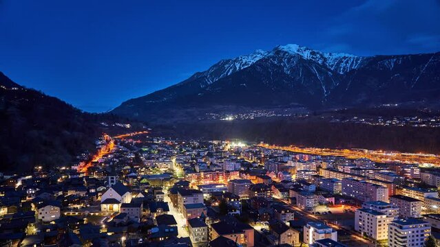 Night timelapse over Brig, a town in the Swiss alps, Switzerland