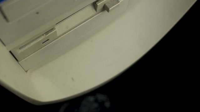 Inserting Floppy Diskette With DOS Operating System In Drive on 1980's PC, Close Up