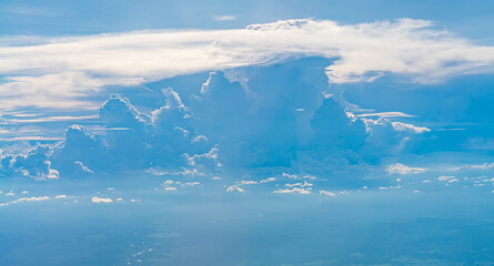 Fototapeta premium View over the clouds above Tanzania. Bright skyscape