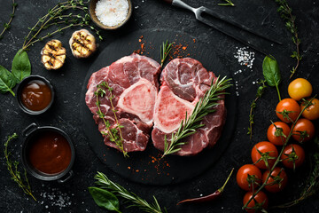 Raw veal Ossobuko steak with bone. Meat. On a stone background.